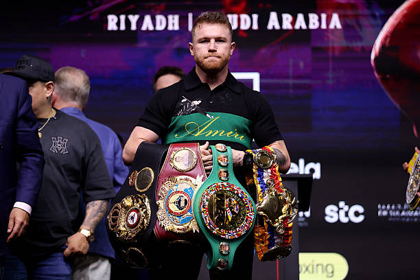 RIYADH, SAUDI ARABIA - MAY 01: Canelo Alvarez poses for a photo with his belts during a press conference ahead of his IBF, WBC and WBO World Super Middleweight titles fight against William Scull as part of the Fatal Fury City of Wolves card at Boulevard City Studio on May 01, 2025 in Riyadh, Saudi Arabia.  (Photo by Richard Pelham/Getty Images)